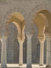 Beautifully curved sandstone arcades with finely carved columns, Tunis in Africa with ruins from