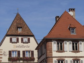 Historic half-timbered houses with floral decorations in Alsace, Wissembourg, France, Europe