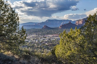 The town of Sedona, Arizona in a valley surrounded by red rock limestone rock formations, United