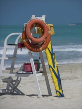 Lifeguard station with life buoy and ladder on the beach, Abu Dhabi, United Arab Emirates, Asia