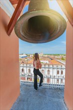 Tourist girl at the viewpoint of the La Merced church with a panoramic view of the Granada