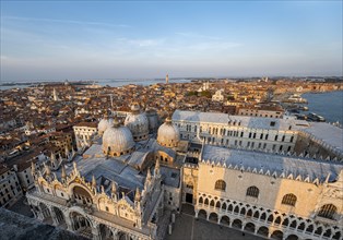 View over the roofs of Venice with St Mark's Basilica and Doge's Palace in the evening light, view