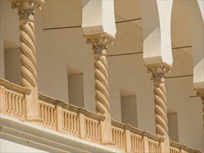 Close-up of architectural columns with ornate details in a light-coloured building, Tunis in Africa