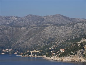 Panorama of a coastal landscape with mountains and houses on the hillside, the old town of
