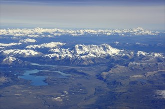 Aerial view of the snow-covered Andes of Patagonia, in the foreground Cerro San Lorenzo with Perito