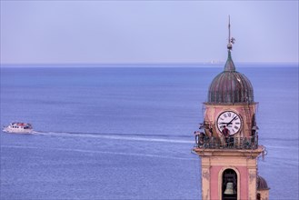 Workers at the top of Church of Santa Maria Assunta, Camogli, Liguaia, Italy, Europe