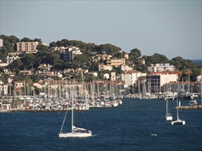 Coastal town with a lively harbour full of boats and waterfront houses, la seyne sur mer, france