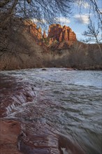 Cathedral Rock sandstone formations tower over Oak Creek at the Crescent Moon Picnic Site in