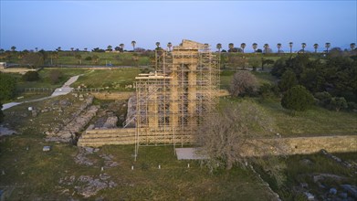 Acropolis of Rhodes, Ancient temple in ruins, supported by scaffolding for restoration, surrounded
