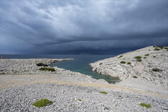 Stormy atmosphere and dark clouds on the coast, island of Pag, Zadar, Dalmatia, Croatia, Europe