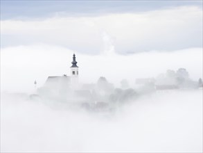 Church rises out of the morning mist, Frauenberg pilgrimage church, near Leibnitz, Styria, Austria,