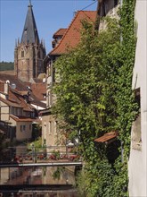 Historic half-timbered houses with floral decorations in Alsace, Wissembourg, France, Europe