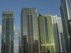 Modern skyscrapers with glass facades in setting sunlight, Abu Dhabi, United Arab Emirates, Asia