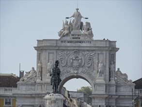 Close-up of a majestic triumphal arch and statue in a city with ornate details, Lisbon, Portugal,