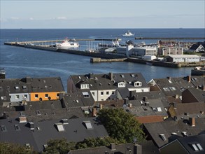 View of harbour town with many buildings and several ships in the water, Heligoland, Germany,