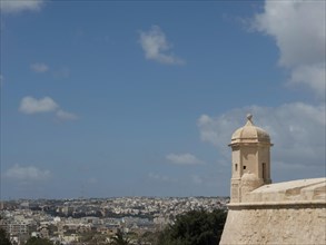Tower rises into the sky, the cityscape stretches out in the background, Valetta, Malta, Europe
