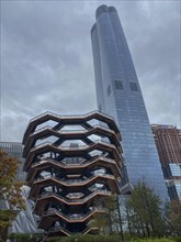 Modern architectural building under a cloudy sky as part of the urban landscape, the skyline of new