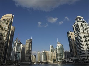 Modern skyline of Dubai with various skyscrapers and blue sky, dubai, arab emirates