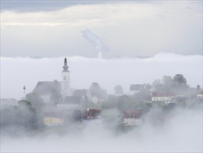 Church rises out of the morning mist, Frauenberg pilgrimage church, near Leibnitz, Styria, Austria,