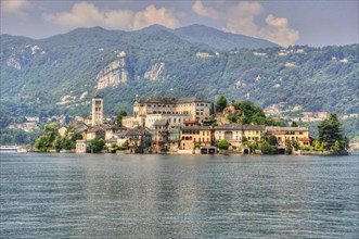 Beautiful Island San Giulio on Lake Orta and Mountain in a Sunny Day in Orta, Piedmont, Italy,