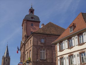 Historic half-timbered houses with floral decorations in Alsace, Wissembourg, France, Europe