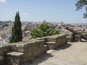 Viewpoint with historic wall and view over the city, Lisbon, Portugal, Europe