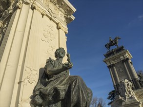 Monumental sculptures and architecture, in the centre a seated figure and an equestrian figure in