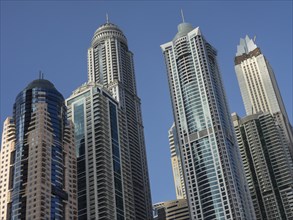 Group of modern skyscrapers in front of a clear blue sky, Dubai, Arab Emirates