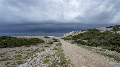Stormy atmosphere and dark clouds on the coast, island of Pag, Zadar, Dalmatia, Croatia, Europe