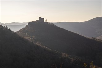 View of Trifels Castle, from Engels Landing rock, with the young tower in autumn at sunset.