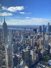 New York skyline in daylight, the Empire State Building is striking under a cloudy sky, new york