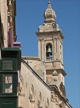 Baroque bell tower of a historic building under a clear blue sky, Historic buildings with beautiful