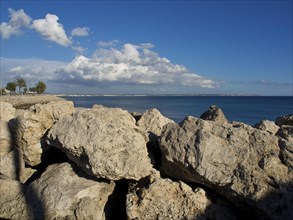 Coastline with large rocks and sea views under blue sky and clouds, palma de mallorca on the