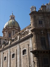 Church building with a magnificent green dome and detailed architectural elements, palermo in