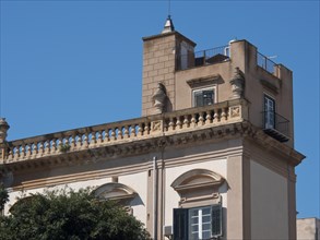 Classic villa with balcony and mediterranean architecture on a sunny day, palermo in sicily with an
