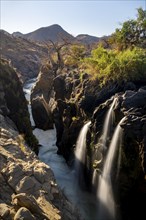 Epupa Falls waterfall on the Kunene River backlit, long exposure, Kunene, Namibia, Africa