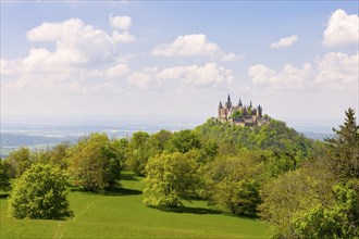 Hohenzollern Castle near Hechingen, cloudy sky, Zollernalbkreis, Swabian Alb, Baden-Wuerttemberg,