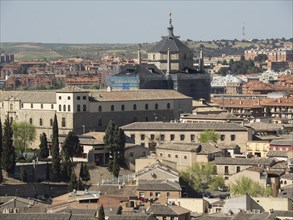Panoramic view of a historic city with striking buildings and church domes, toledo, spain