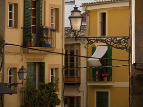 Idyllic city view with colourful house facades, balconies and a lantern, palma de Majorca with its