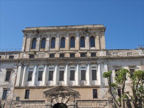 Historic building with columns and many windows, in a classic architectural style, palermo in
