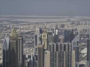 Wide-angle shot of skyscrapers and surrounding urban environment by day, Dubai, Arab Emirates