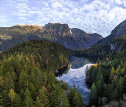 Mountain peaks of the Oetztal Alps reflected in Lake Piburger See, in autumn, near Oetz in Oetztal,
