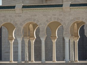 Sandstone columns and arcades with arches that cast shadows in daylight, Tunis in Africa with ruins