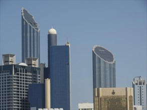 Modern skyscrapers with unique design and clear blue sky in the background, Abu Dhabi, United Arab