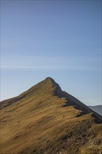 View of a striking mountain peak in a clear sky landscape, mountain panorama with rugged mountains