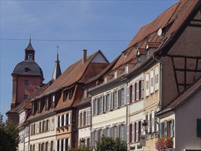 Historic half-timbered houses with floral decorations in Alsace, Wissembourg, France, Europe