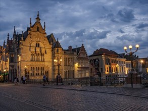 A typical old town with historic buildings and lanterns at dusk, blue hour in a medieval town with