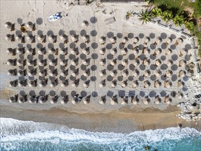 Top Down over Umbrellas and Beach in Himare from a drone, Albanian Riviera, Albania, Europe