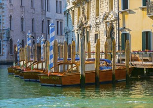 Beautiful and Elegant Motorboats in a Row and Palace with Sunlight on Grand Canal in a Sunny Day in