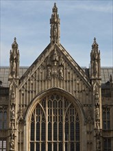 Close-up of a Gothic building, large windows and ornate facade, sky in the background, London,